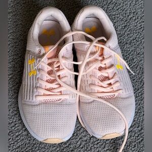 UNDER ARMOUR PINK SURGE RUNNING SHOES. Pink with yellow logo. Size 6.